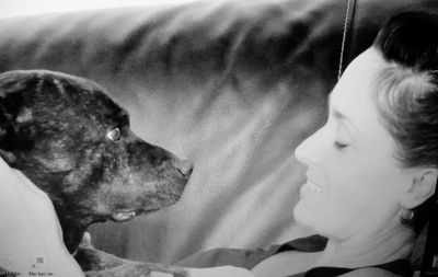 Close-up portrait of boy with dog