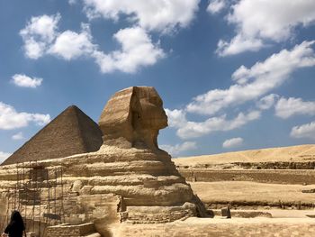 View of sculpture against cloudy sky