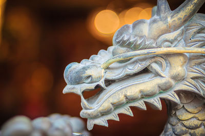 Close-up of statue against temple