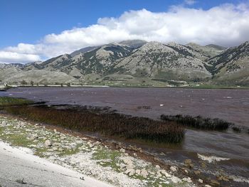 Scenic view of landscape and mountains against sky