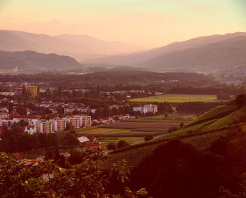 Aerial view of townscape against sky during sunset