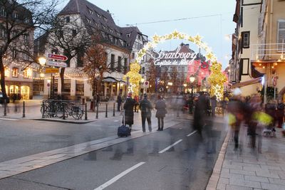 People at decorated city street for christmas