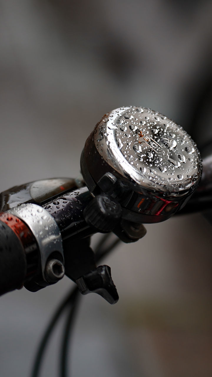 CLOSE-UP OF BICYCLE HOLDING METAL WITH REFLECTION