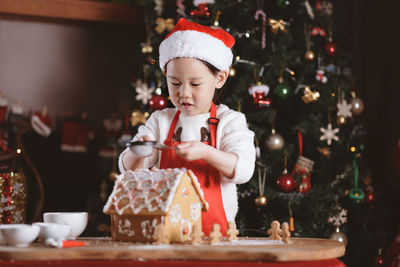 Boy looking at christmas tree