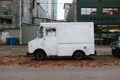Vintage car on street against old building