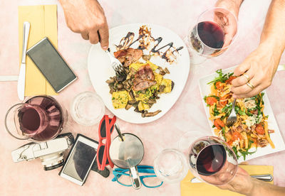 Directly above view of man and woman standing on table