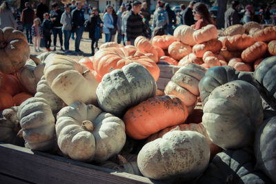 Group of people for sale at market stall