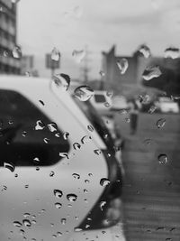 Close-up of raindrops on glass window