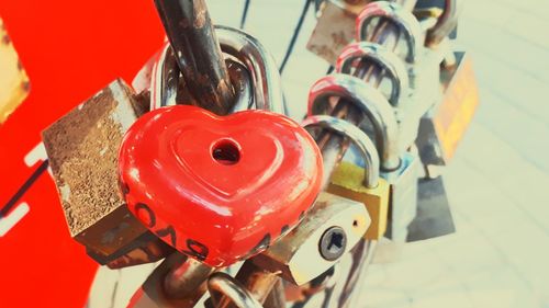 Close-up of padlocks hanging on metal