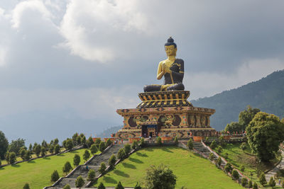 Low angle view of statue against sky