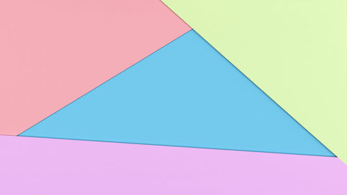 High angle view of multi colored umbrella against blue background