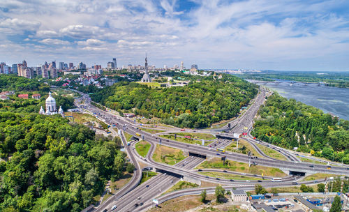 High angle view of road by buildings against sky