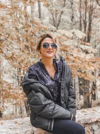 Portrait of young woman wearing sunglasses