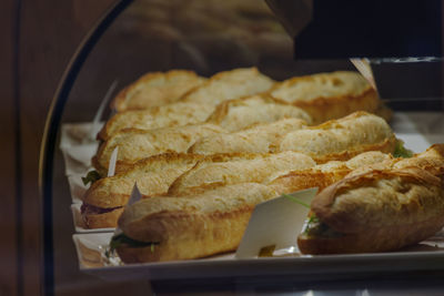 Freshly made bucket sandwiches line up in the showcase