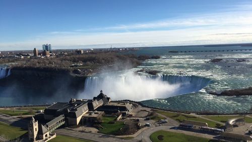 Scenic view of niagara falls against sky