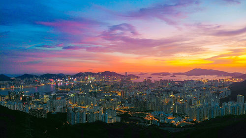 High angle view of buildings against sky during sunset