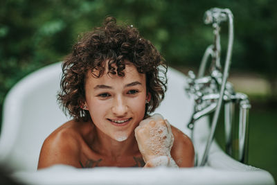 Portrait of smiling young woman outdoors