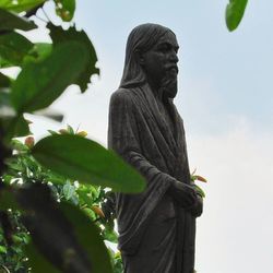 Low angle view of statue against sky