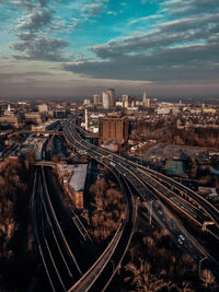 High angle view of railroad tracks amidst buildings in city