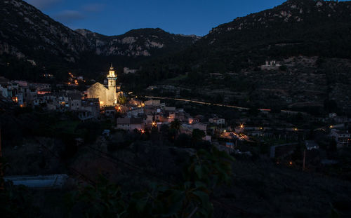 High angle view of illuminated buildings in town at night