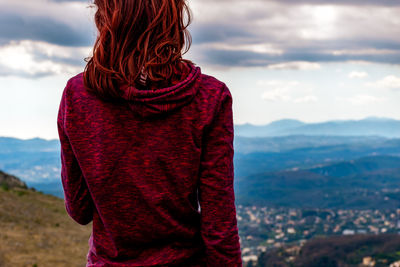 Rear view of woman looking at mountains