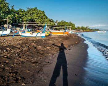 Shadow of people on beach