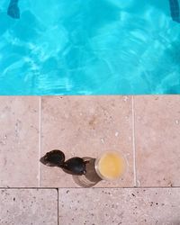 High angle view of drink on swimming pool