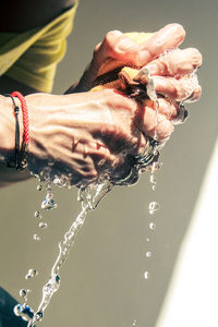 Close-up of hand holding water