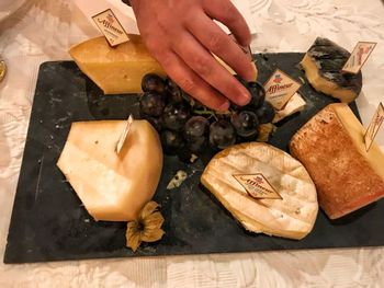 High angle view of man preparing food on cutting board