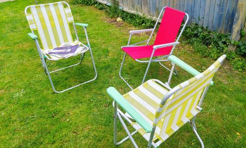 Empty deck chairs in back yard