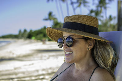 Portrait of young woman wearing hat