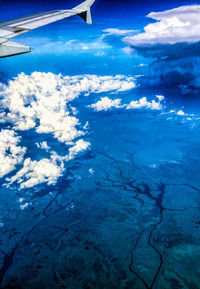 Aerial view of landscape against blue sky