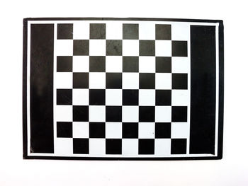 Close-up of chess against white background