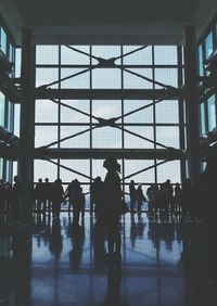 Silhouette people walking in airport