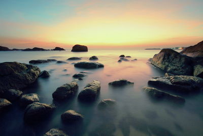 Scenic view of sea at sunset