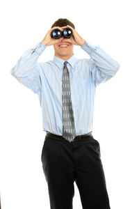 Portrait of man standing against white background