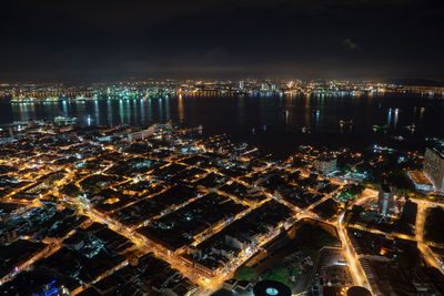 High angle view of illuminated city buildings at night