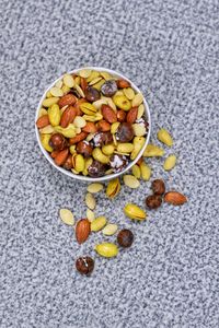 High angle view of pills in bowl on table