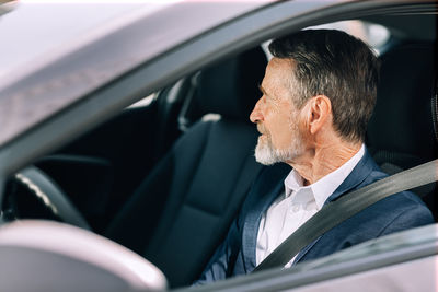 Portrait of man in car