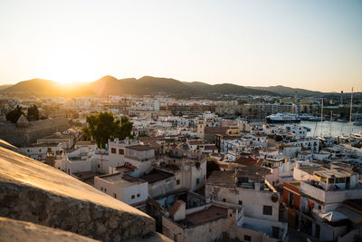 High angle view of townscape against sky during sunset