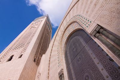 Low angle view of mosque hassan ii against sky