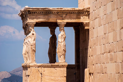 Low angle view of statue against sky