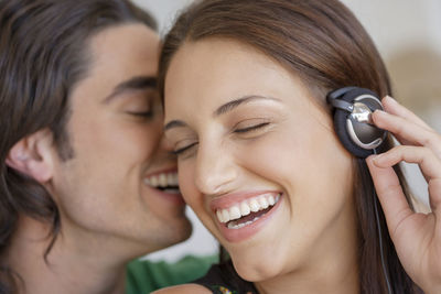 Close-up of smiling couple at home