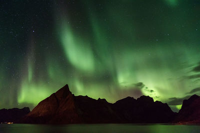 Low angle view of mountain against sky at night