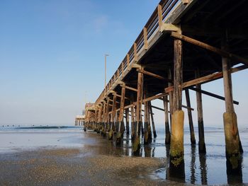 Pier over sea against sky