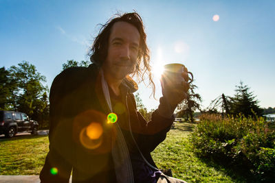 Portrait of man against sky on sunny day