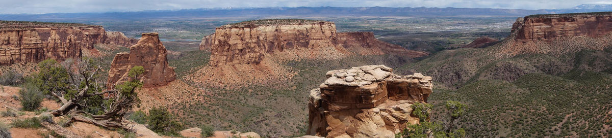 Panoramic view of rock formations against sky