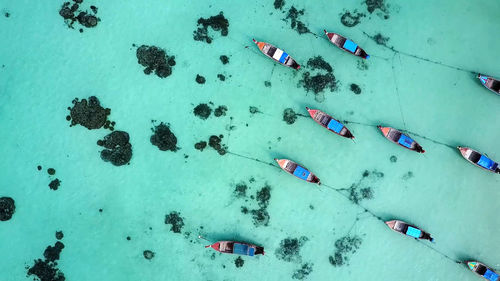 Aerial view of boats in blue sea