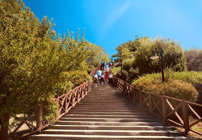 Low angle view of people on staircase