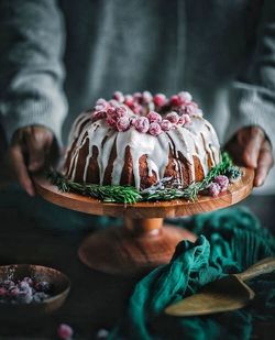 Close-up of hand holding cake